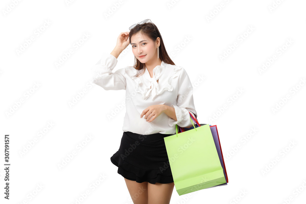 Portrait of an excited beautiful woman holding shopping bags isolated on white. Portrait of an excited beautiful woman holding shopping bags isolated on white.