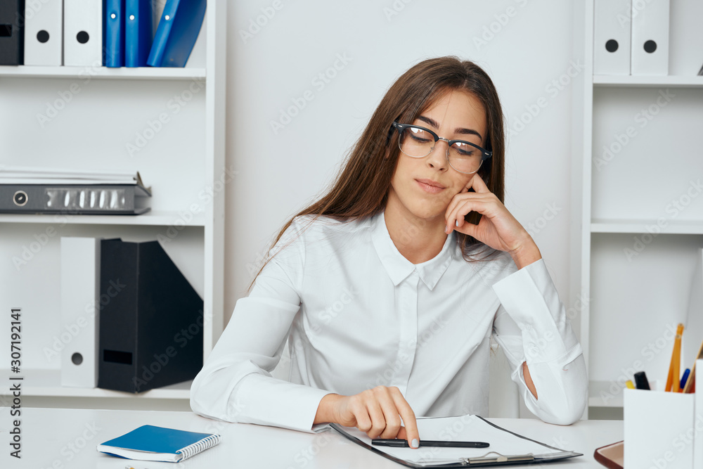 businesswoman talking on phone in office businesswoman talking on phone in office