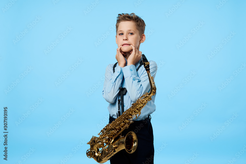 Fototapeta premium young man with a saxophone