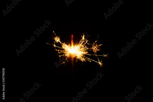 Lit Sparklers Against Black Background