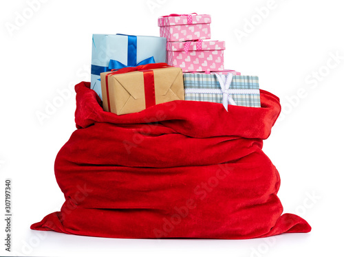 Santa Claus red bag full of Christmas boxes with gifts  isolated on white background. File contains a path to isolation