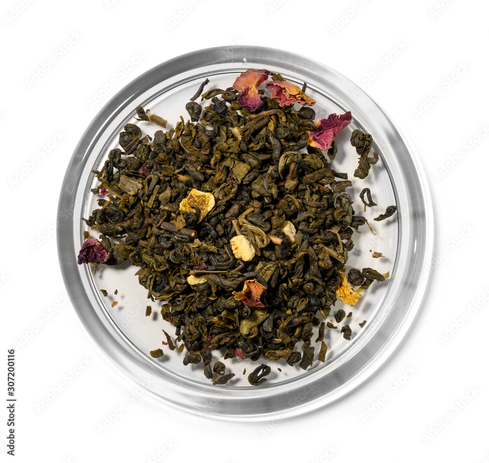 Green tea with aromatic additives. Top view on white background Green tea with aromatic additives. Top view on white background