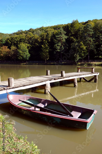 Wooden boat on the shore of the lake