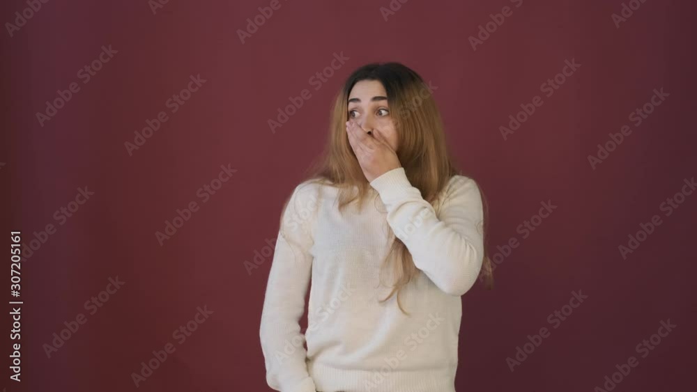 Girl hear something bad, holding for her head, looks very confused and looks in different directions Girl hear something bad, holding for her head, looks very confused and looks in different directions