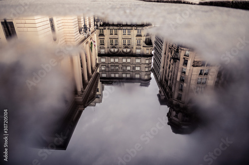 Prédios do centro histórico de São Paulo refletidos em poça d´água photo
