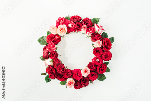 Fototapeta Naklejka Na Ścianę i Meble -  Flat lay frame border with blank copy space mockup made of pink and red rose flowers on white background. Top view floral concept.