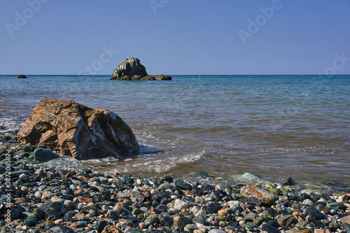 Rock and boulders on the coast of the Aegean Sea in Greece.