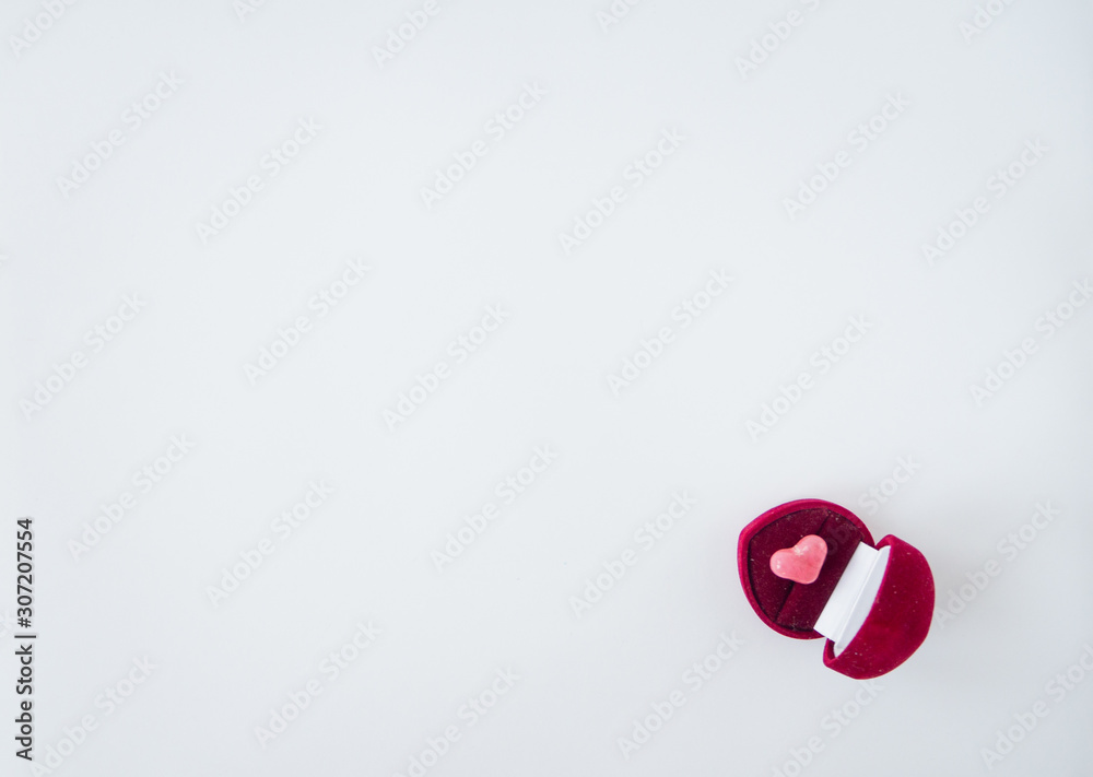 Fototapeta premium Valentines day card or composition with box in shape of heart with pink heart inside. Top view, flat lay, copy space. 