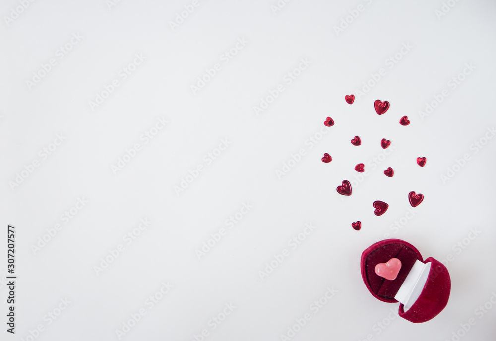 Valentines day card or composition with box in shape of heart with pink heart inside and small hearts . Top view, flat lay, copy space. Valentines day card or composition with box in shape of heart with pink heart inside and small hearts . Top view, flat lay, copy space.