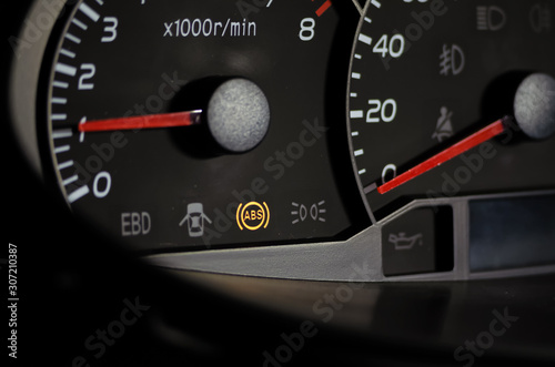 The ABS sensor lights up orange in the car dashboard.