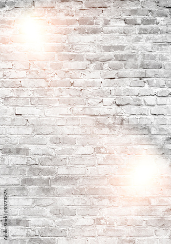 White brick wall with lights.