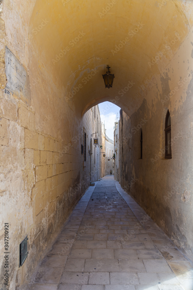 doorway to an tiny and narrow street in Mdina
