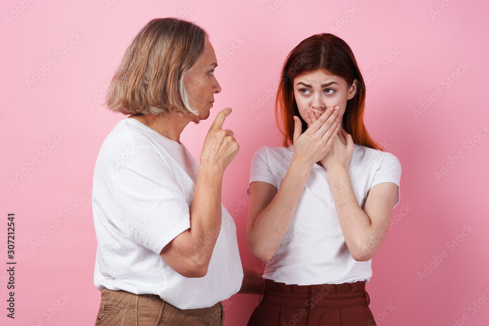 two women whispering gossip
