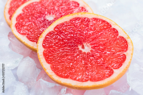  Grapefruit slices on ice. Close-up.
