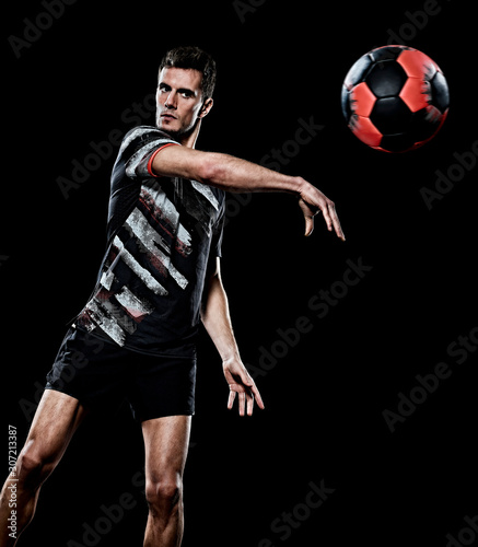 one caucasian young handball player man in studio isolated on black background © snaptitude