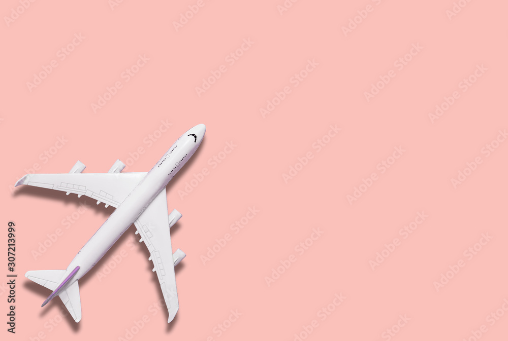 Airplane model and text space on pink background Airplane model and text space on pink background