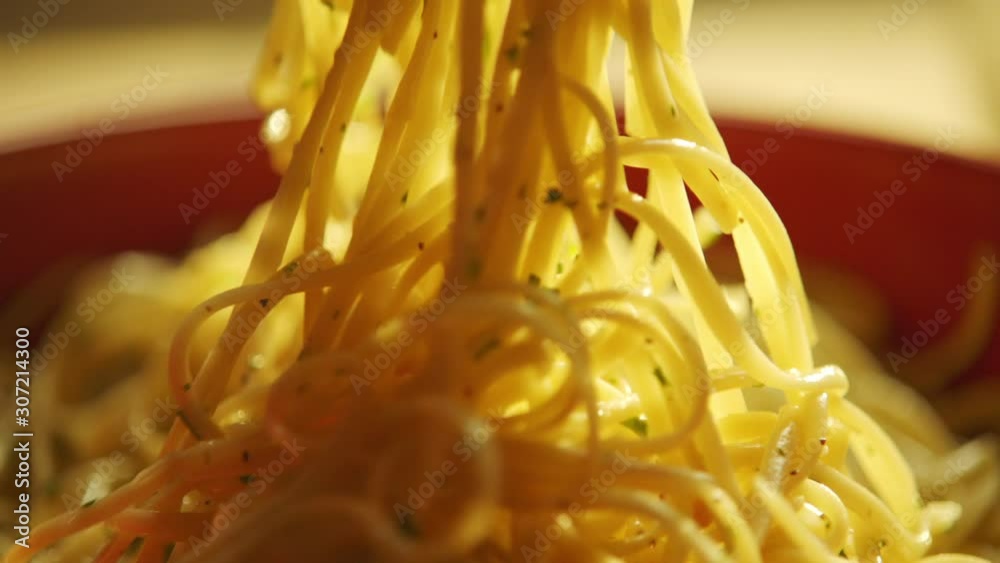 spaghetti tossed in extreme close up in slow motion