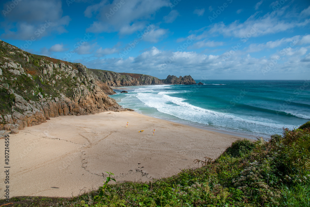 View of Porthcurno Beach in south Cornwall on a cloudy September day.