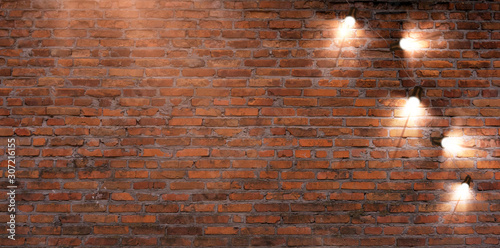 Brick wall with a garland o...