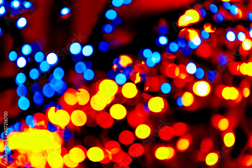 Colorful circles bokeh festive glitter dark background. Holiday greeting cards, invitations, flyers, blog posts, banners design. Christmas lights bokeh overlay.