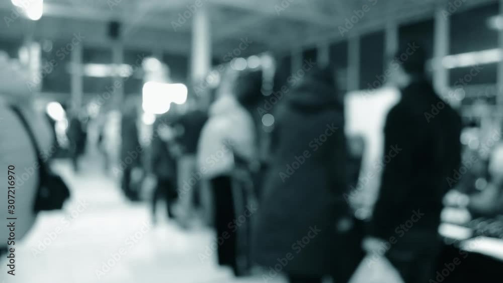 Crowd lot of people in mall. Blurred Abstract Background. Blurred View Crowd lot of people in mall. Blurred Abstract Background. Blurred View