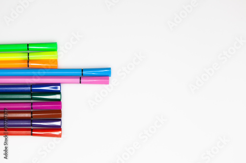 Felt-tip pens over white background