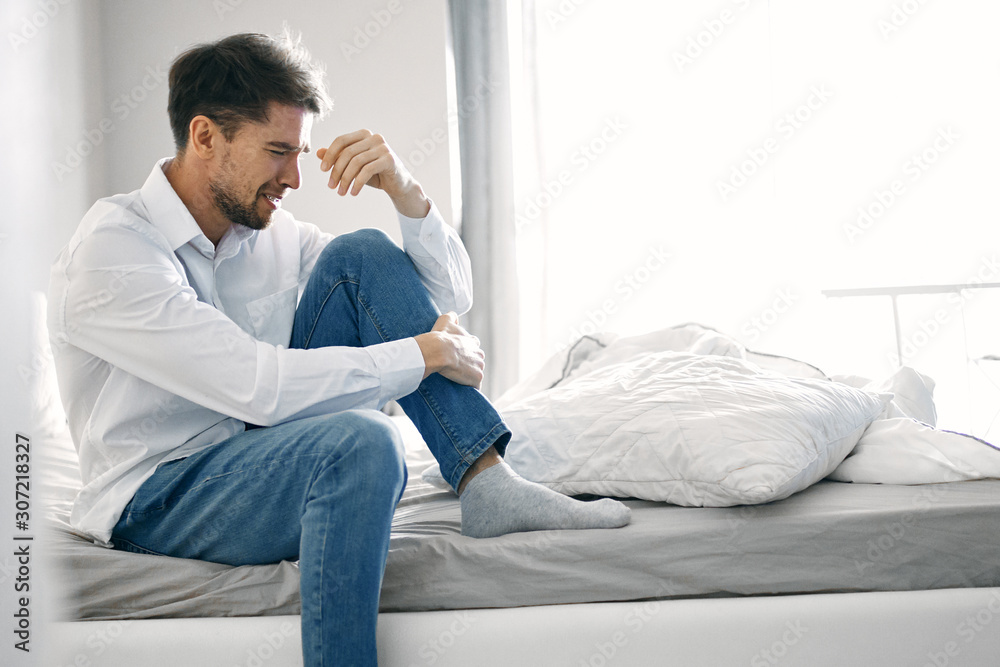 man sitting on sofa and talking on phone man sitting on sofa and talking on phone