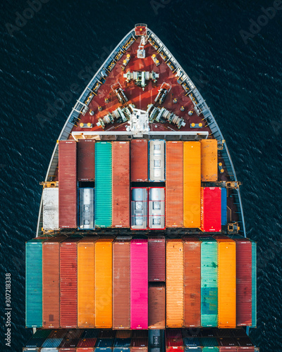 Aerial photography of white boat with multicolored shipping containers