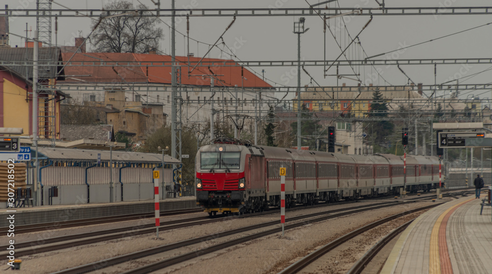 Fast passenger train with red modern electric engine in Ilava station Fast passenger train with red modern electric engine in Ilava station