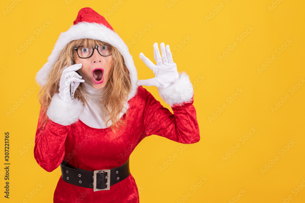santa claus woman with mobile phone isolated on color background santa claus woman with mobile phone isolated on color background