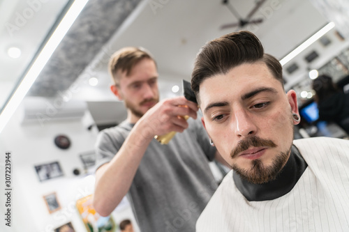Men's haircut and hair styling. Men's beauty and hair care. 