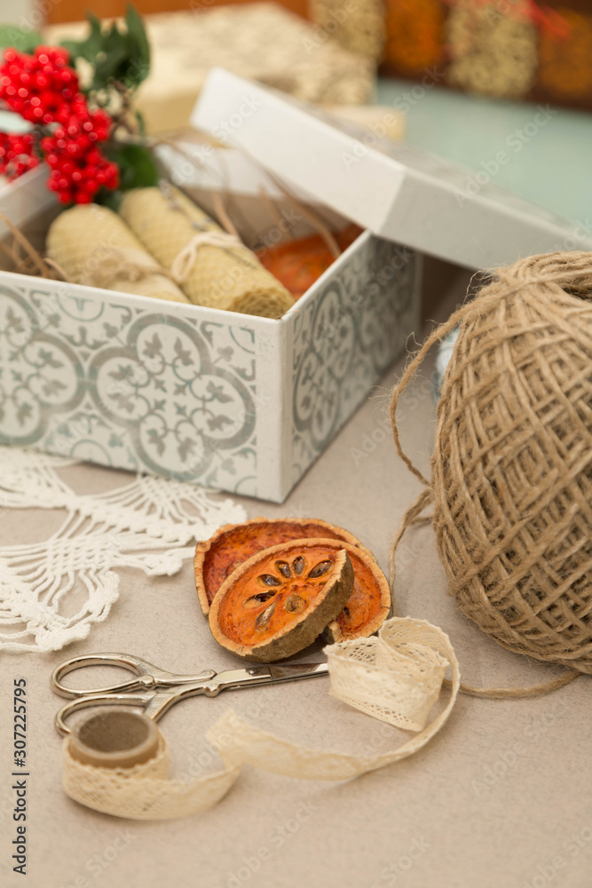Natural candles packing in the box. Gifts packing. Gifts wrapping.Vintage. Vertical Natural candles packing in the box. Gifts packing. Gifts wrapping.Vintage. Vertical