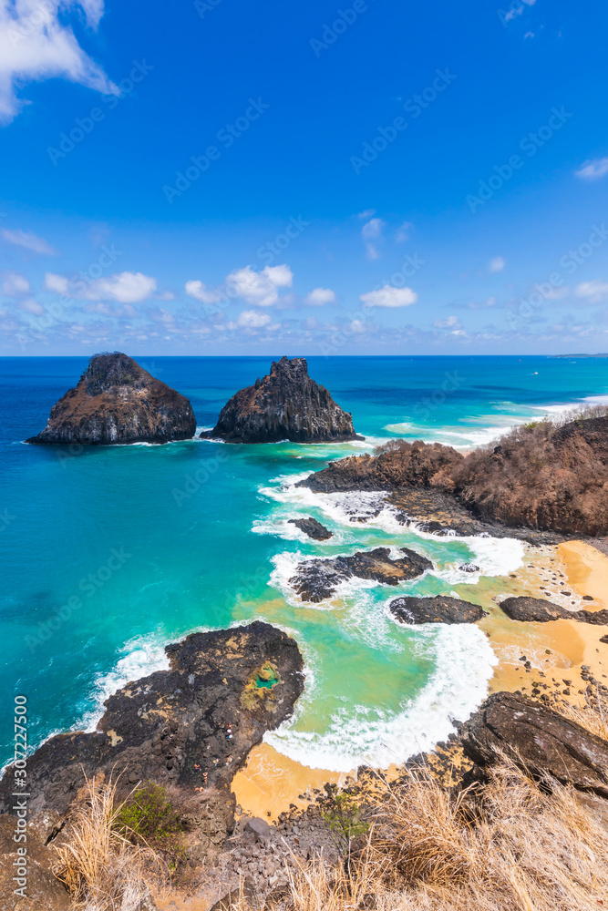 View of Morro dos Dois Irmãos and Baia dos Porcos in Fernando de Noronha, a paradisiac tropical island off the coast of Brazil View of Morro dos Dois Irmãos and Baia dos Porcos in Fernando de Noronha, a paradisiac tropical island off the coast of Brazil