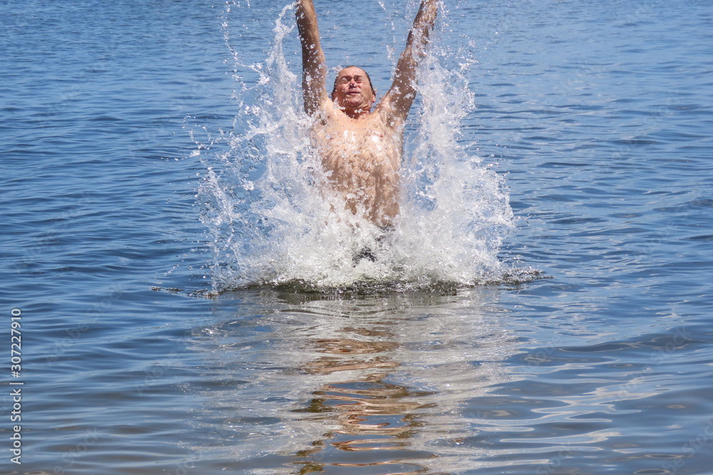 man jumping in water