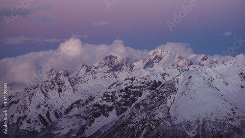 Snowy mountain peaks beautiful landscape at sunset