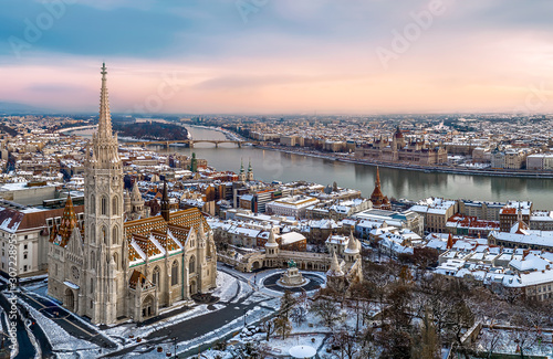 Aerial cityscape from Budapest with cloudly sky, Matthas church, fishermans bastion, Danube river and Hungarian Parliament.