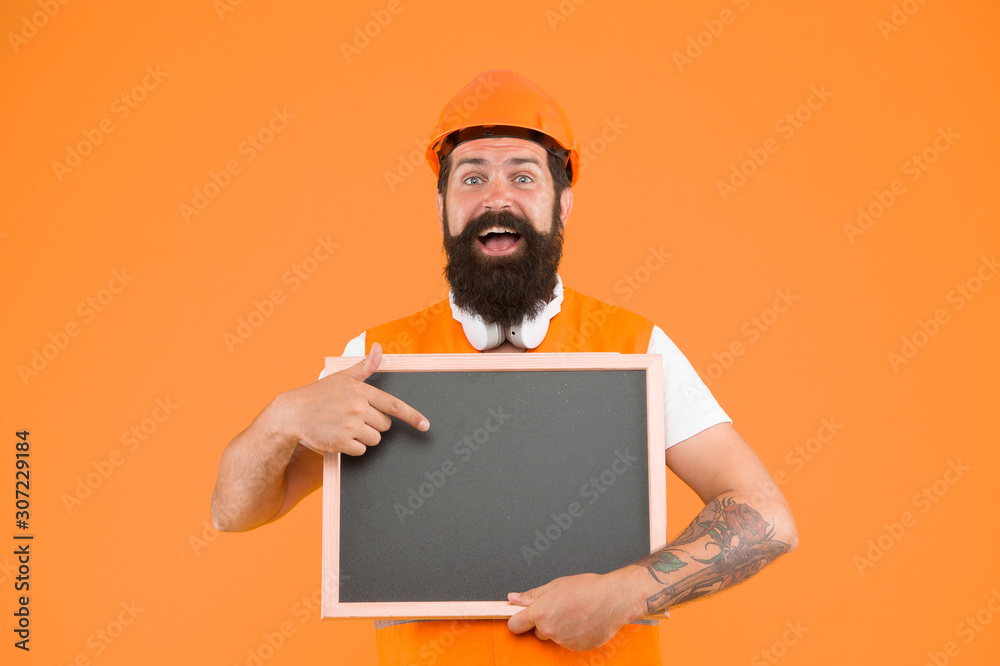 Foreman builder concept. Worker builder bearded face. Builder in helmet. Install and repair pipes and fittings of water supply. Man hard hat hold chalkboard copy space. Announcing services Foreman builder concept. Worker builder bearded face. Builder in helmet. Install and repair pipes and fittings of water supply. Man hard hat hold chalkboard copy space. Announcing services