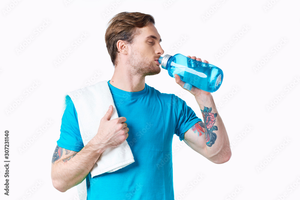 young man with bottle of water isolated on white young man with bottle of water isolated on white