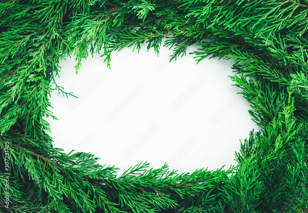 Christmas and New Year decoration with fir branches on white background. Merry Christmas.