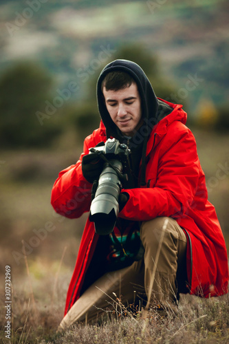 Close up of photographer taking photos in nature