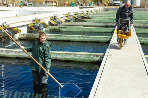 Photography Male and female fish farm workers
