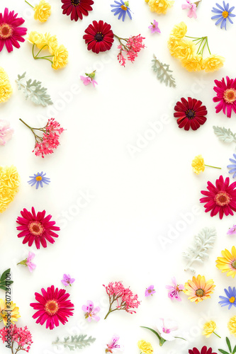 Fototapeta Naklejka Na Ścianę i Meble -  Egg shaped frame made from spring flowers.  Easter  spring holiday concept.Flat lay, top view, copy space