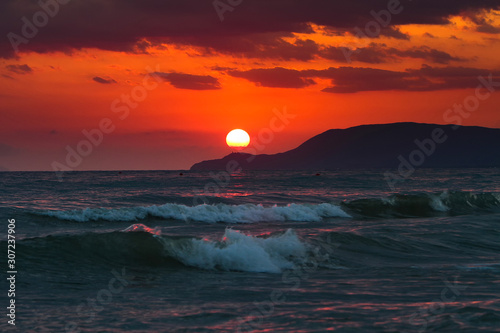 Dramatic sunset sunrise over the italian tirrenean coastline,Tuscany, Marina di Grosseto, Castiglione Della Pescaia, Italy photo