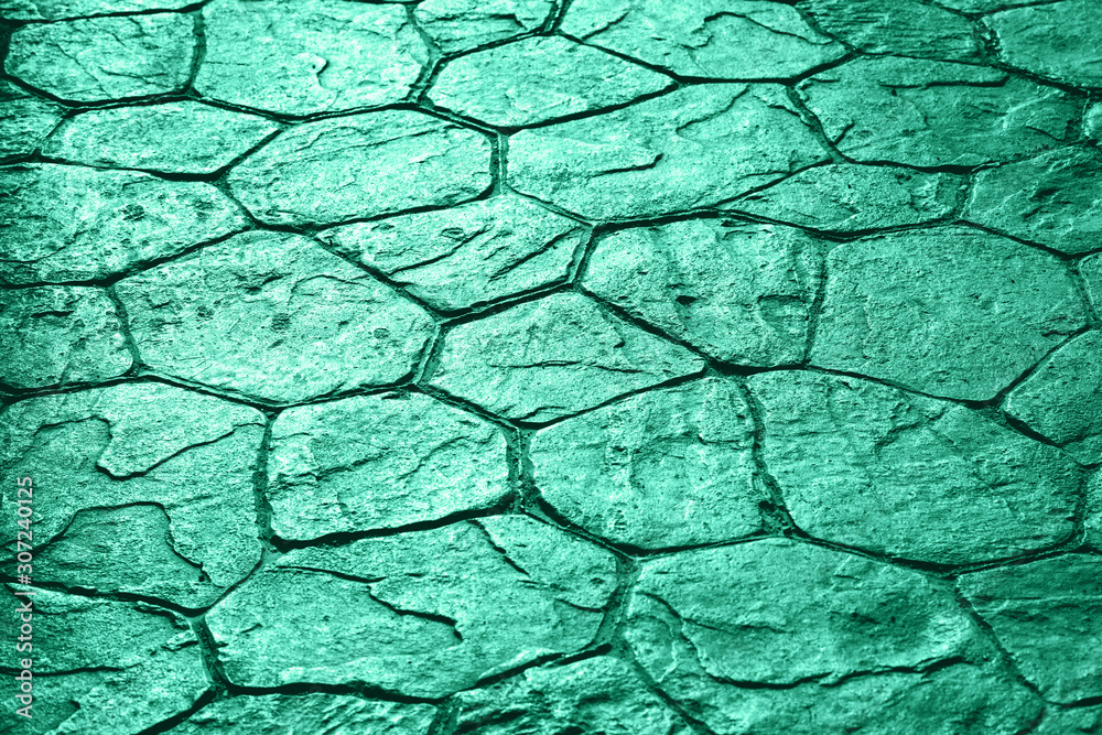 Limestone stone pavement uneven texture background in trendy biscay green or neo mint monochrome color shades with copy space Limestone stone pavement uneven texture background in trendy biscay green or neo mint monochrome color shades with copy space