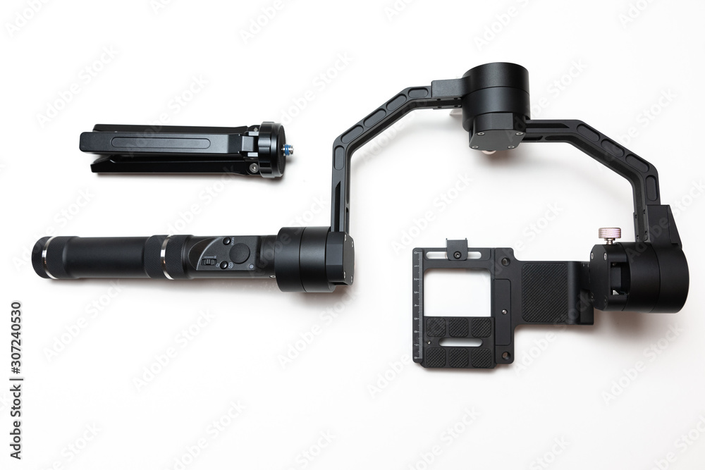 DSLR camera gimbal three-axis motorized stabilizer Tripod System on a white background, isolated DSLR camera gimbal three-axis motorized stabilizer Tripod System on a white background, isolated