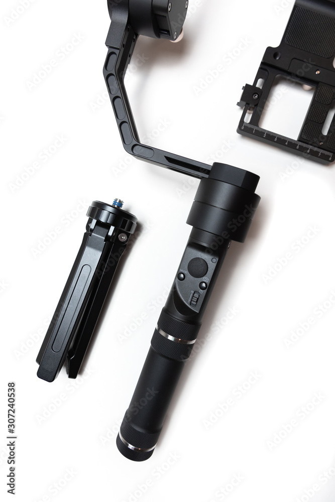 DSLR camera gimbal three-axis motorized stabilizer Tripod System on a white background, isolated DSLR camera gimbal three-axis motorized stabilizer Tripod System on a white background, isolated