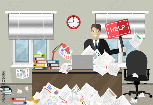 Business man needs help under a lot of documents in office at the desk and holding a HELP placard