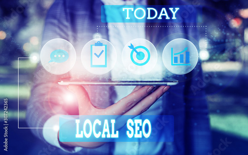 Text sign showing Local Seo. Business photo showcasing This is an effective way of marketing your business online Female human wear formal work suit presenting presentation use smart device photo