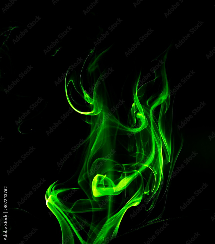 Green smoke on black background Green smoke on black background