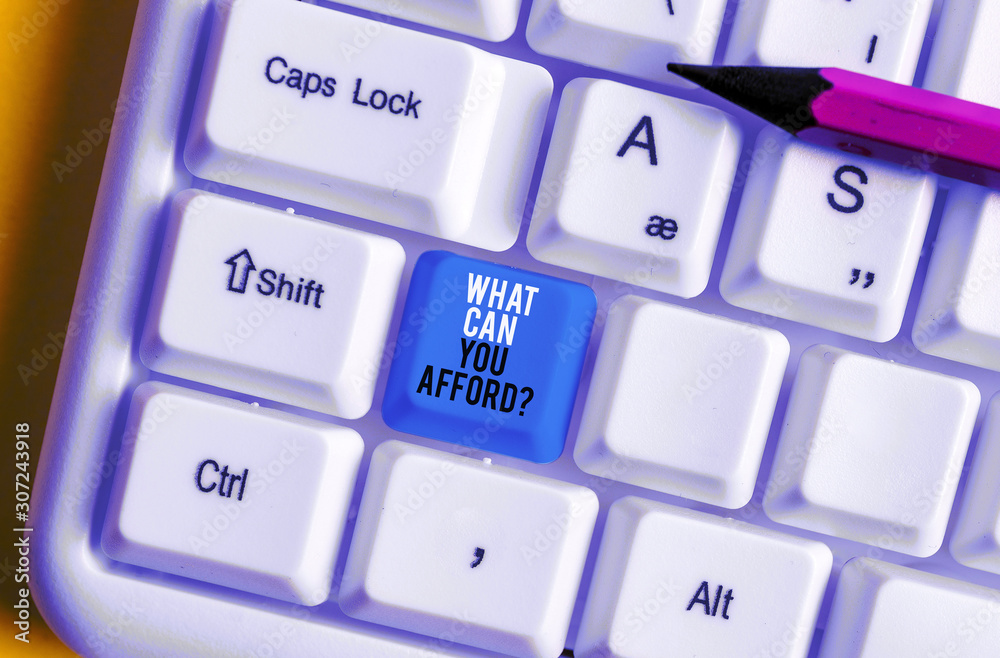 Conceptual hand writing showing What Can You Afford Question. Concept meaning Give us your budget availability of money White pc keyboard with note paper above the white background Conceptual hand writing showing What Can You Afford Question. Concept meaning Give us your budget availability of money White pc keyboard with note paper above the white background